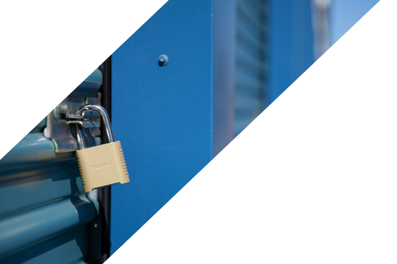 Service Representative in holding clipboard in front of storage containers